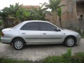 Jual mazda familia 323 thn 97 warna silver, full orsinil, mesin kering