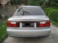 Jual mazda familia 323 thn 97 warna silver, full orsinil, mesin kering