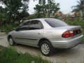 Jual mazda familia 323 thn 97 warna silver, full orsinil, mesin kering