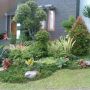 Tukang Taman Minimalis Rumput Swiss Kolam Relief & Saung